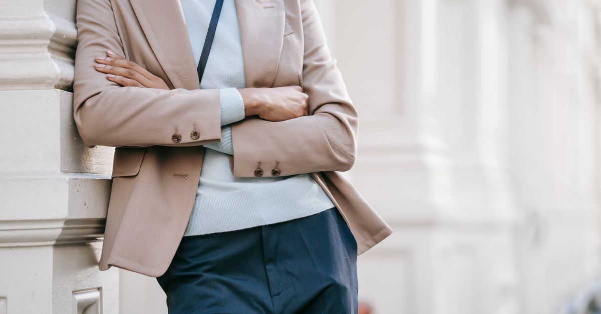 Woman choosing neutral organic cotton clothing