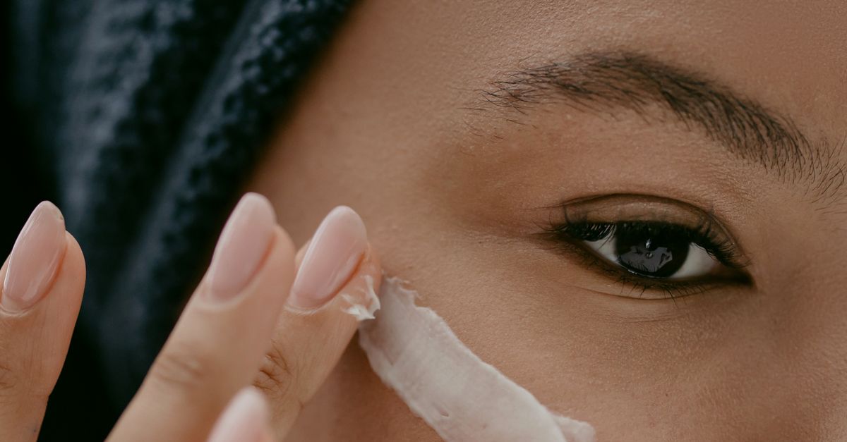 Woman applying luxury face cream